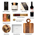 Flat lay of Not Too Sweet (Red), showing all 9 items included in the box, including the Cabernet Sauvignon VQA Red Wine, Fancy Nut Mix and base..