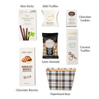 Flat lay of the Richmond, showing all 7 items included in the basket, including Mint Sticks, Dabble & Drizzle Latte Almonds and a paperboard base.