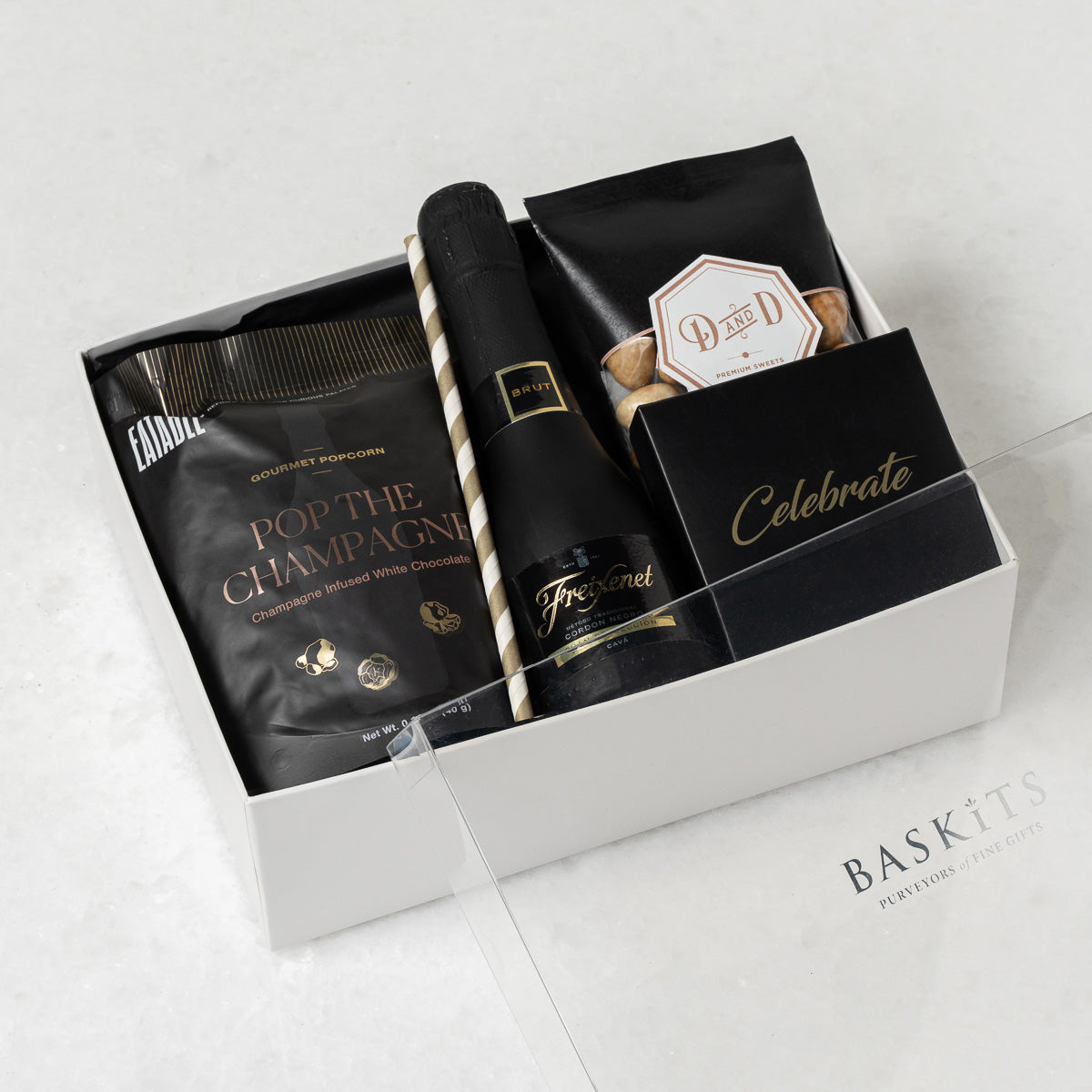 The Cheers!, a gourmet gift box featuring  Assorted Chocolates, Caffe Latte Almonds and Gourmet Chocolate & Sweet Treat items. 