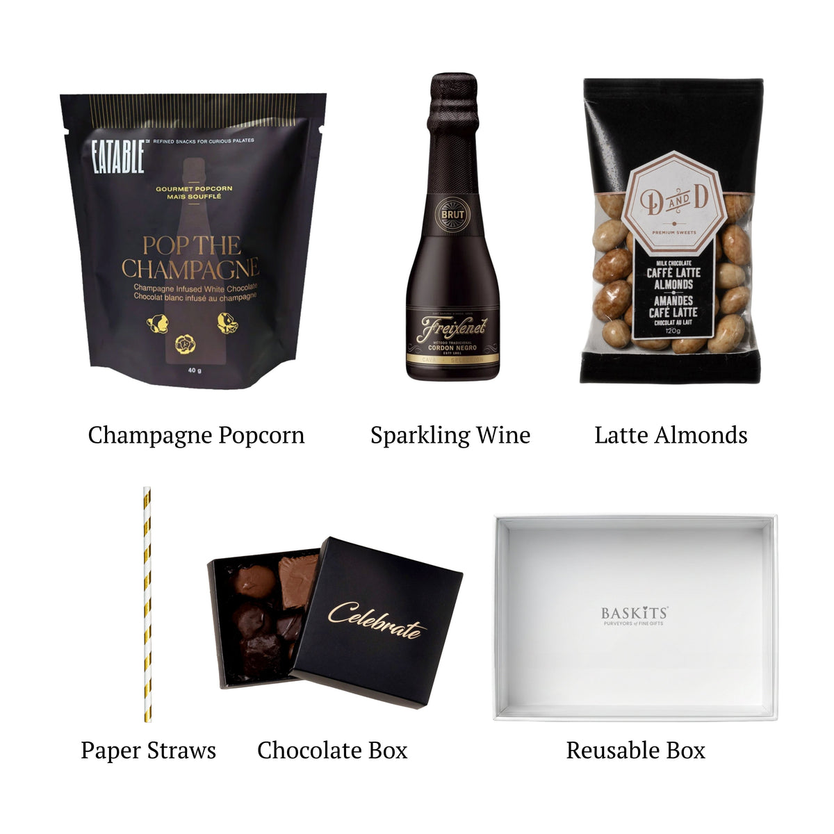 Flat lay of Cheers!, showing all 5 items included in the box, including the Cordon Negro Brut Cava, The Champagne Popcorn and Container.