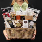 The Forest Hill gourmet gift basket held by a person in a black shirt to show size and scale.