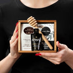 The My Moment gourmet gift box held by a person in a black shirt to show size and scale.