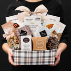 The Champlain M gourmet gift box held by a person in a black shirt to show size and scale.