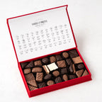Flat lay of Heavenly Bites (M), showing all Over Two Dozen Chocolates items included in the box