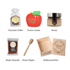 Golden Honey flat lay displaying a rubberwood box base, gourmet raw honey, hand-painted apple-shaped cookies, chocolate toffee, and almond treats.