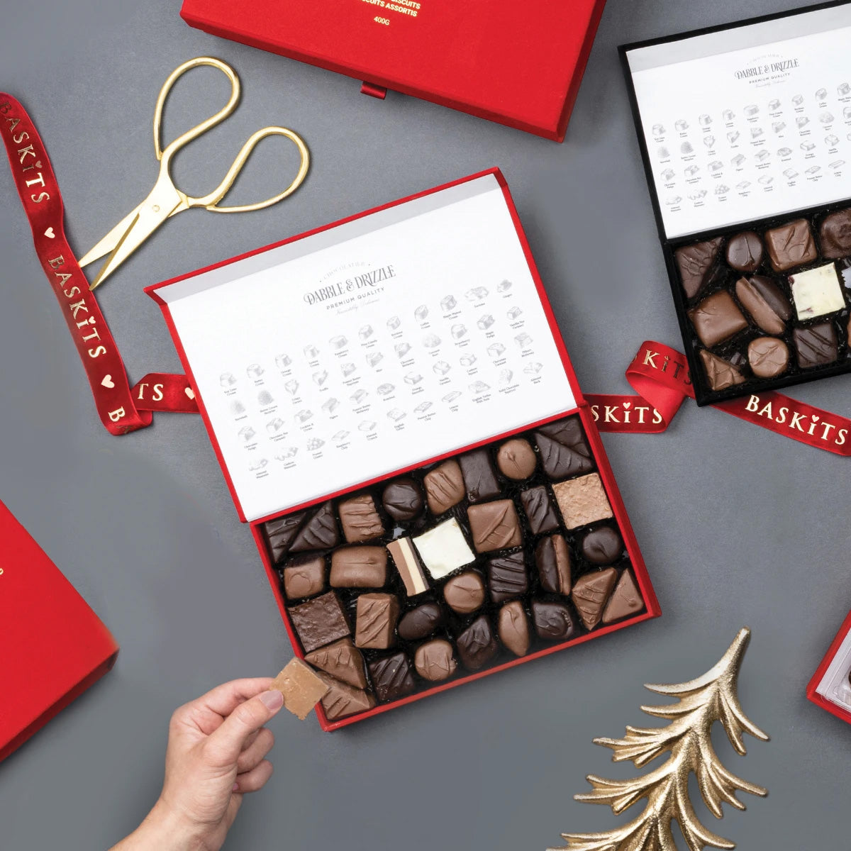 The Heavenly Bites (M) gourmet gift box held by a person to show size and scale.