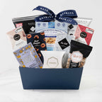 The Kosher L, a gourmet gift basket featuring Milk Chocolate Shorts, Sweet Cinnamon Chocolate Bar and Chocolate & Sweet Indulgences items. 