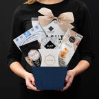 The Kosher S gourmet gift  Paperboard Base held by a person in a black shirt to show size and scale.