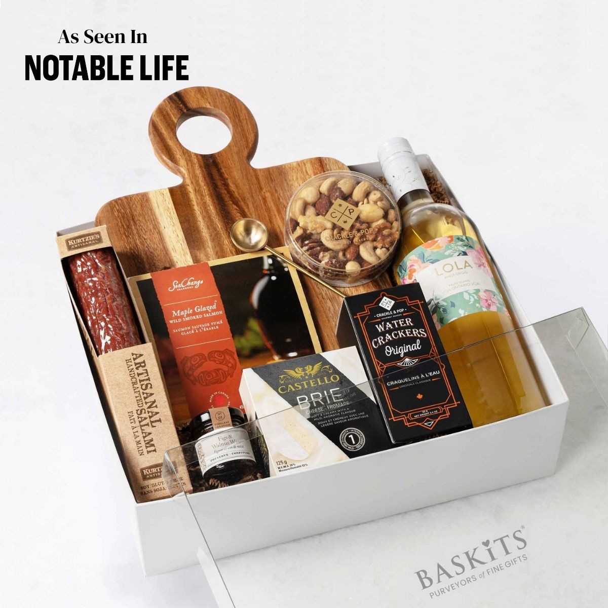 The Not Too Sweet (White), a gourmet gift box featuring Fig & Walnut Wine Preserve, Crackle & Pop Fancy Nut Mix and Gourmet Cheese & Charcuterie items. 