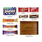 Flat lay of Sweet Treats Tray, showing all 8 items included in the box, including the Smarties Box, Caramilk Chocolate Bar and base.