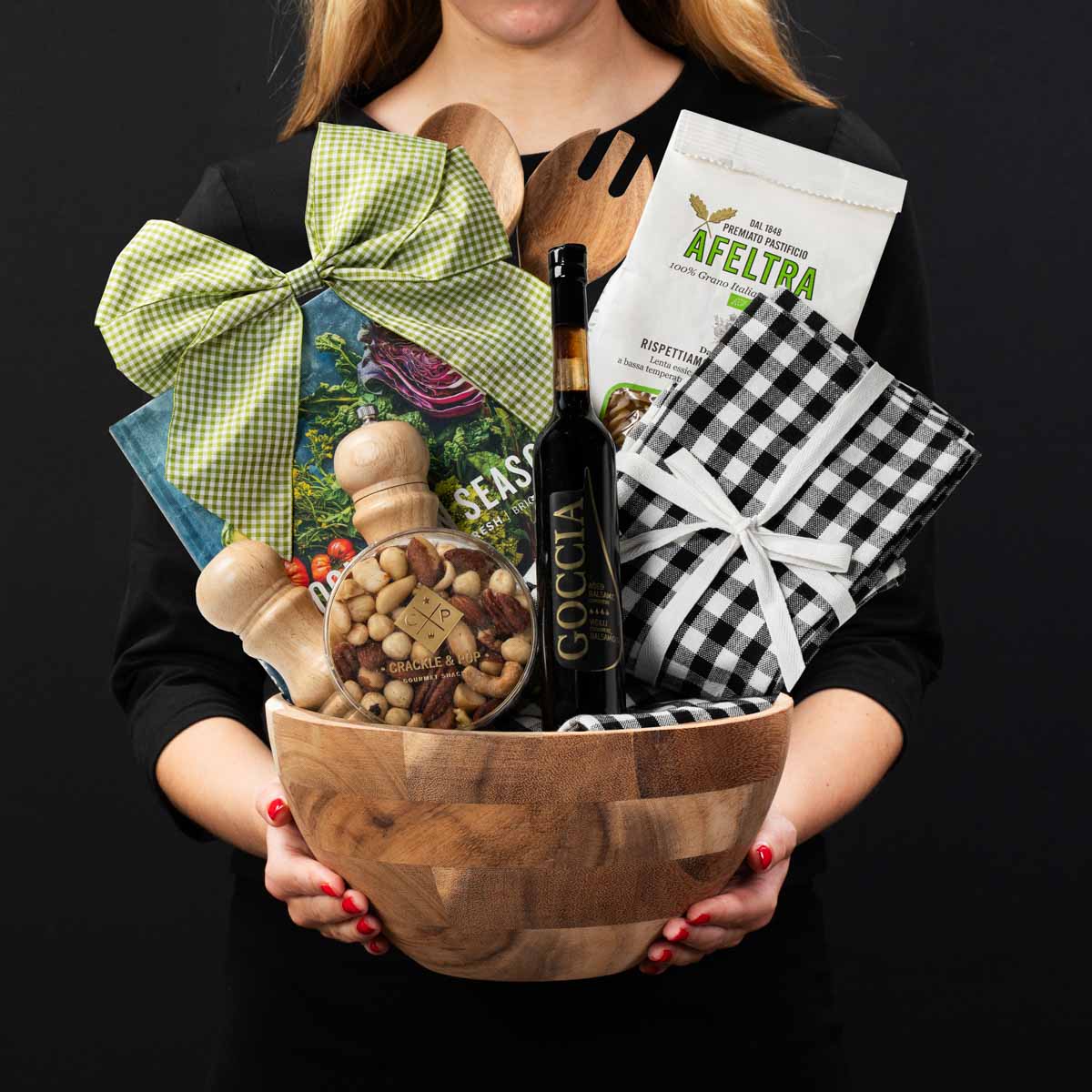 The Salad Bowl gourmet gift bowl held by a person in a black shirt to show size and scale.