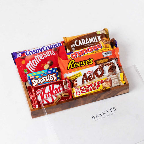 The Sweet Treats Tray is a gourmet gift box featuring KitKat Chocolate Bar, Maltesers Chocolate and Chocolate & Sweet Indulgence items. 