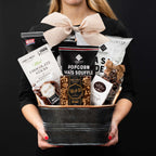 The Champlain S gourmet gift box held by a person in a black shirt to show size and scale.