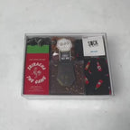 Hands unpacking a 6-piece Hot Stuff gift box, displaying a Dabble & Drizzle Chocolate Fire Square, and an array of essential spicy indulgences. 