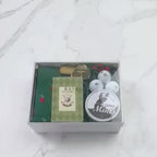 Hands unpacking a 9-piece Fore the Love of Golf gift box, displaying a Tee Time Golf notebook and an array of essential golf items.
