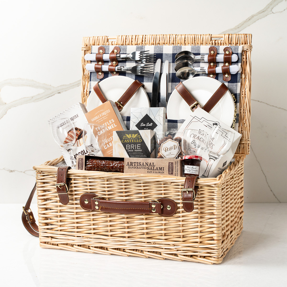 A picnic basket containing cutlery and food